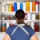 Woman in front of a cluttered pantry