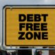 Image of a "Debt Free Zone" sign.