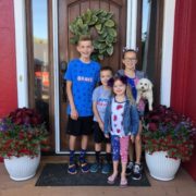 Image showing a family in front of their new home.