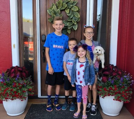 Image showing a family in front of their new home.